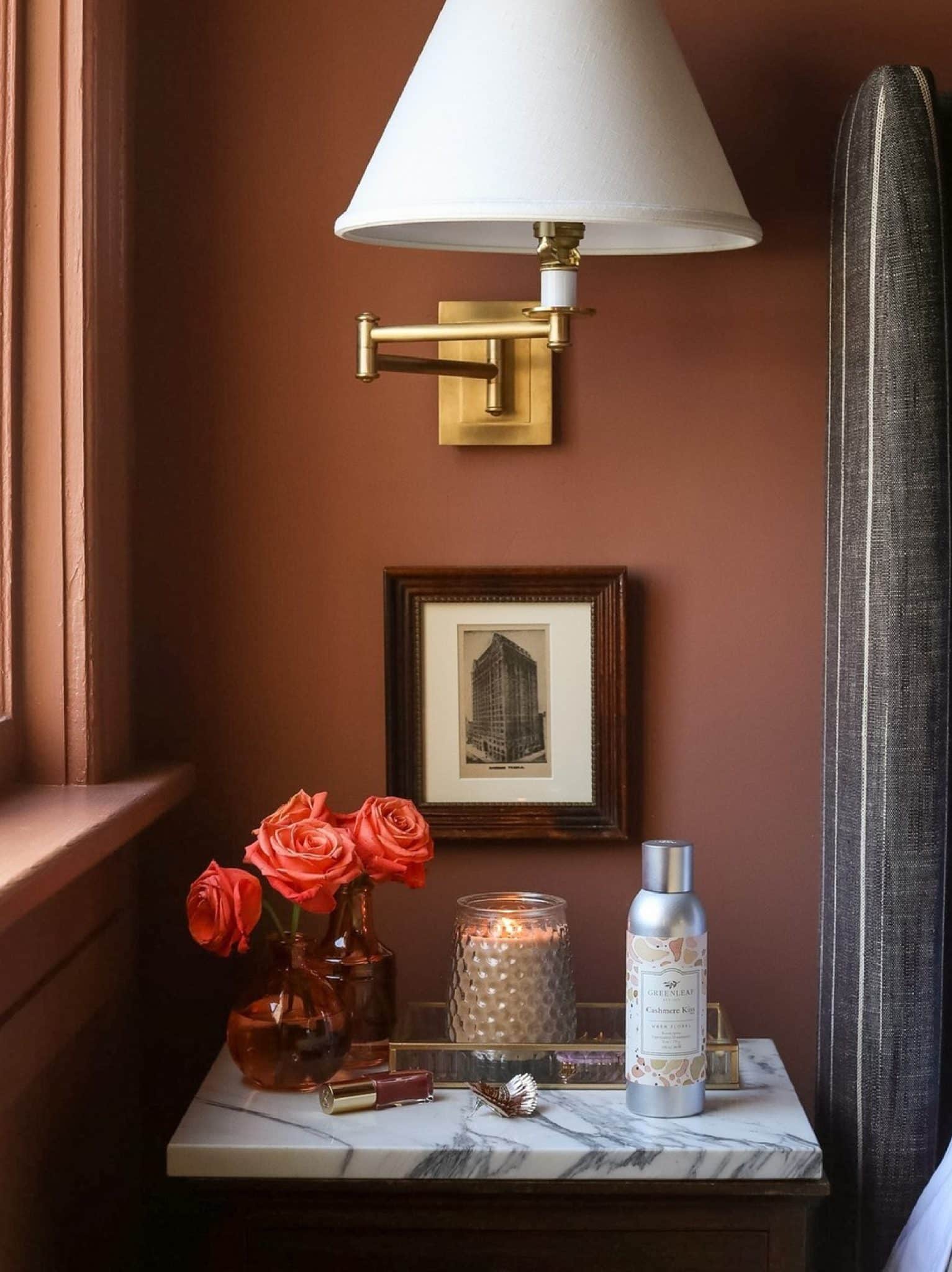 Greenleaf cashmere kiss room spray on a bedside table.